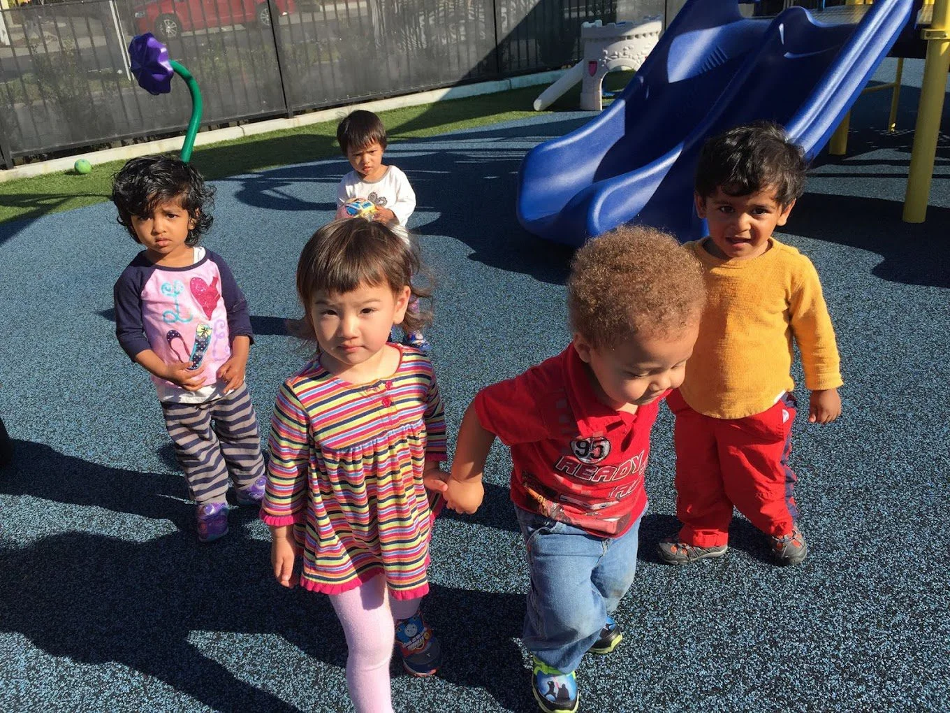 kids after taking slide in play area